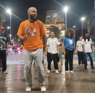 a man with a beard and a beard standing in a city