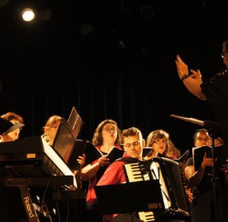 a bandleader playing a musical instrument in a concert