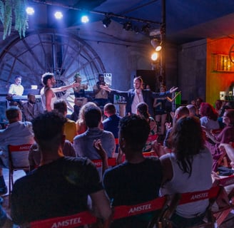 a group of people sitting in chairs in a room