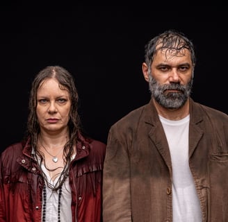 a man and woman standing next to each other