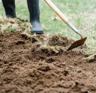 a gardener woring with a hoe