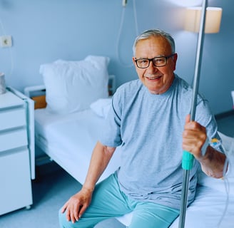 Elderly man receiving IV energy boosting therapy to improve his strength and vitality. Advanced hydr