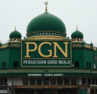 a large green building with a green dome with a green dome