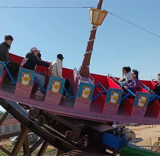 a group of people riding on a roller coaster