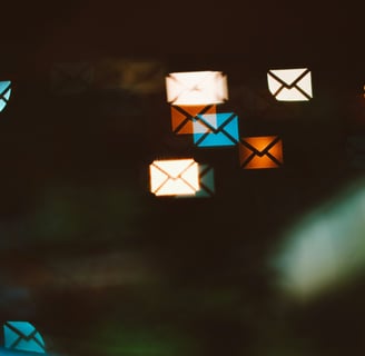 Email marketing concelt - a bunch of colorful envelopes on a black background