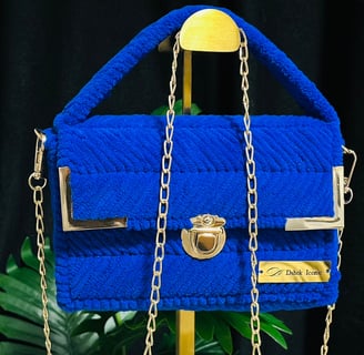 a blue purse with chain link and chain link