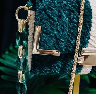 a handbag with a chain link chain and a chain link bracelet