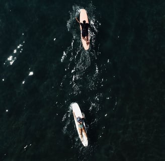 aerial drone view of surfers in batukaras