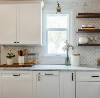 a kitchen with white cabinets and white cabinets