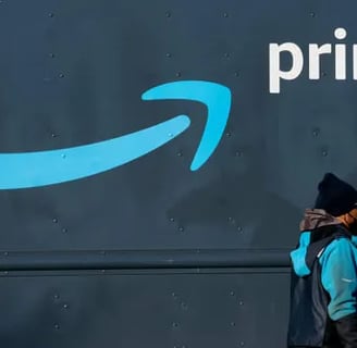 a person walking past a sign that says amazon prime day