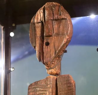a wooden carving of a wooden face close up fro the worlds oldest wooden sculpture