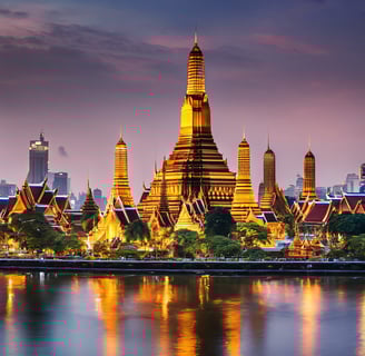 a large boat floating on top of a river next to a tall building