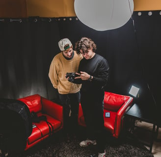 Two men setting up a podcast studio in Dallas, Texas.