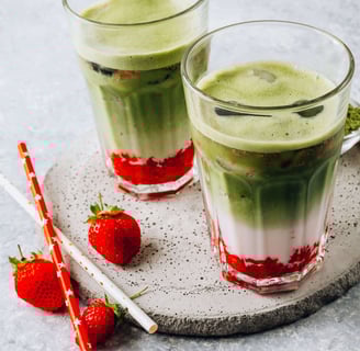 Layered strawberry matcha latte with fresh strawberries