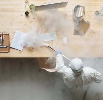 a person is sanitizing an office