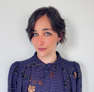 a woman with a purple and gold shirt