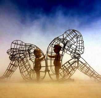 a group of people standing around a sculpture