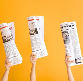 three hands holding up newspapers and a newspaper-digital marketing institution