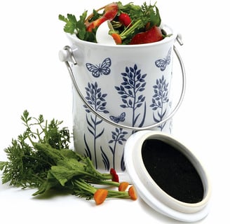 a compost bin with vegetables