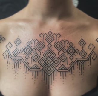 An handpoke tattoo featuring traditional tappis ornamental symmetrical lines geomatric inspired