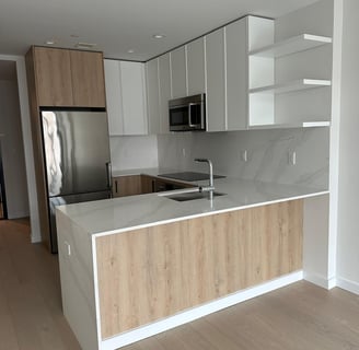 a kitchen with a large island style counter top