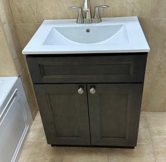 a bathroom sink with a white sink and a white sink