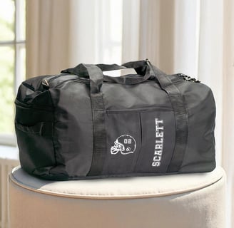 a duffel bag with a helmet on it
