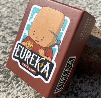 Eureka the mining card game deck on a rock table