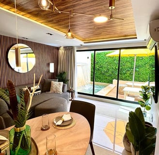 Diseño interior, sala abierta con vista a la alberca, aspecto tropical, vegetación, airbnb,