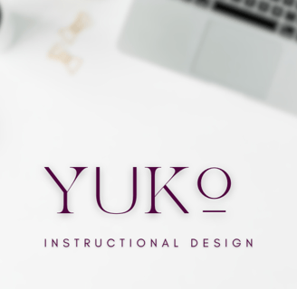 A blurry top down aesthetic desk setup with Yuko Instructional Design written.