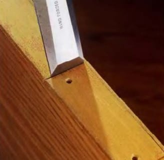 a knife cutting the wood
