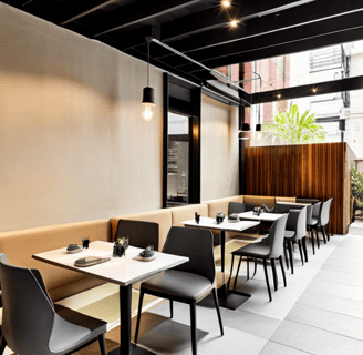 a restaurant with a long table and chairs