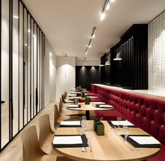 a restaurant with a long table and chairs