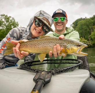 A photo of Kids fishing on the South Holston River in Tennessee.