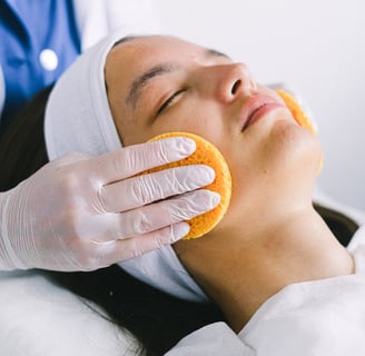 a woman with a towel on her face and a towel on her head