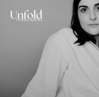 a woman in a robe is holding a tie