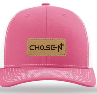 a pink hat with a leather label on it