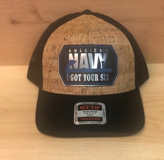 a hat with a navy blue and white logo on it