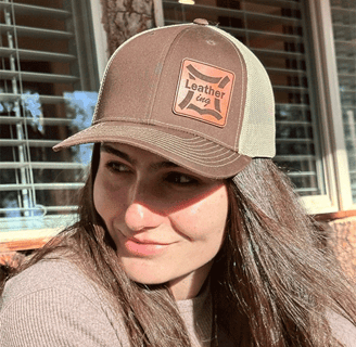 a woman with long hair and a hat on