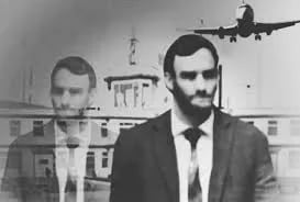 mysterious man holding a passport from the fictional country Taured at an airport