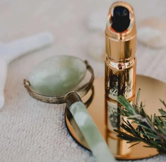 a bottle of liquid in a gold toned and a bottle of liquid
