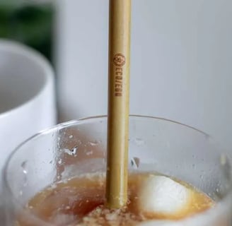 a cup of coffee with a strawberries and a strawberries
