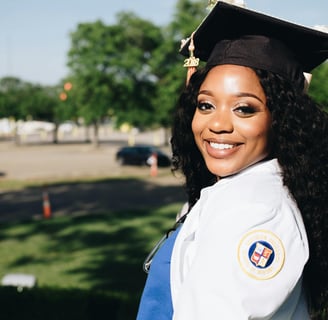 a woman in a graduation cap and gown