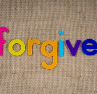 a colorful word written in the word forgive