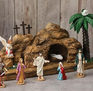 a nativity scene with figurines of jesus in a cave