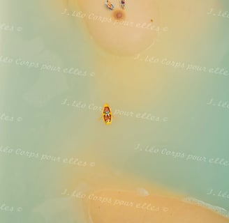 a couple of people are sitting on a beach