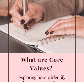 woman using journal to identify core values