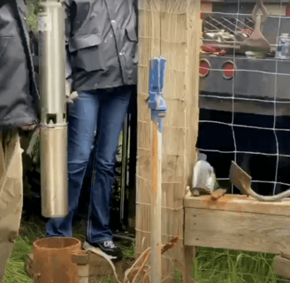 Technician installing a new submersible pump