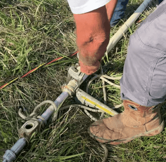 man installing new pipe fittings
