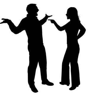 a man and woman standing in silhouettes